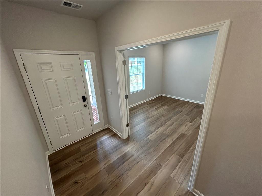 27 Stonebrook Drive Rome, GA 30165 - Photo 9 of 22 an empty room with wooden floor and closet