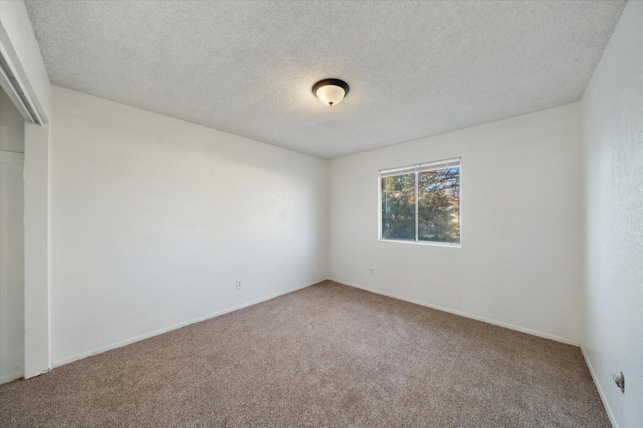 1994 Spruce Circle Anderson, CA 96007 - Photo 11 of 16 an empty room with a window