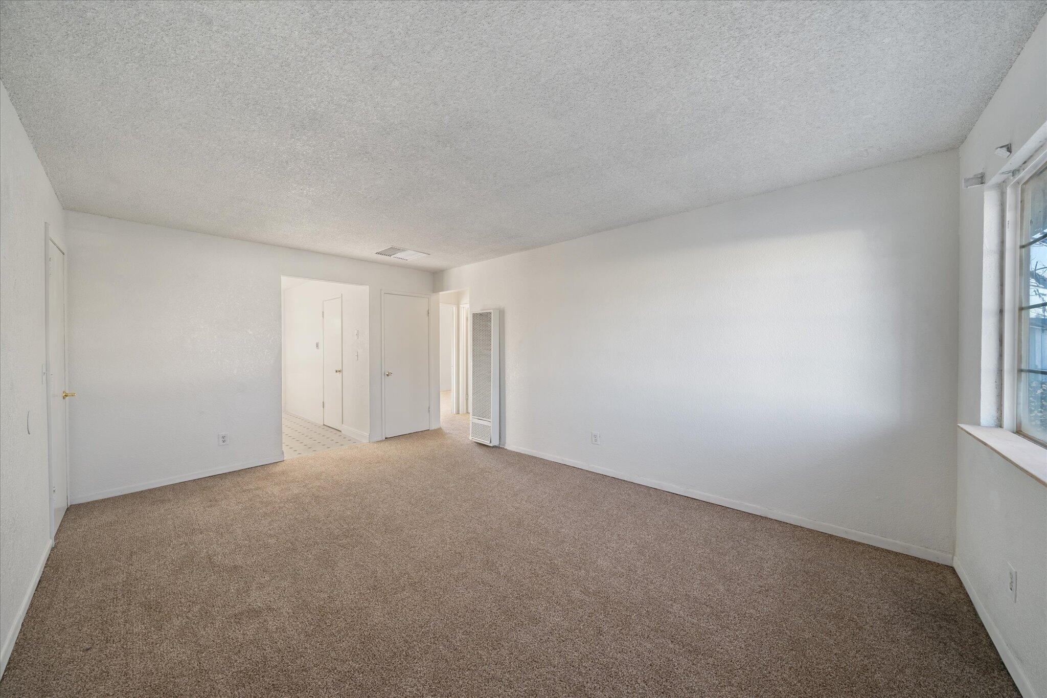 1994 Spruce Circle Anderson, CA 96007 - Photo 2 of 16 a view of an empty room and a window