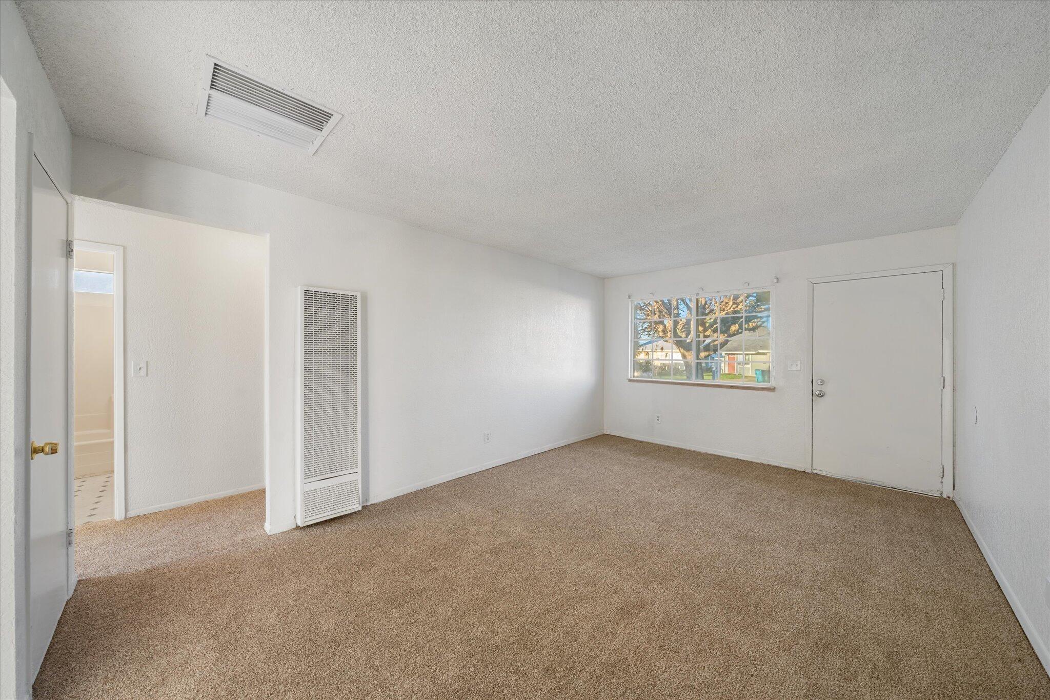 1994 Spruce Circle Anderson, CA 96007 - Photo 3 of 16 an empty room with windows