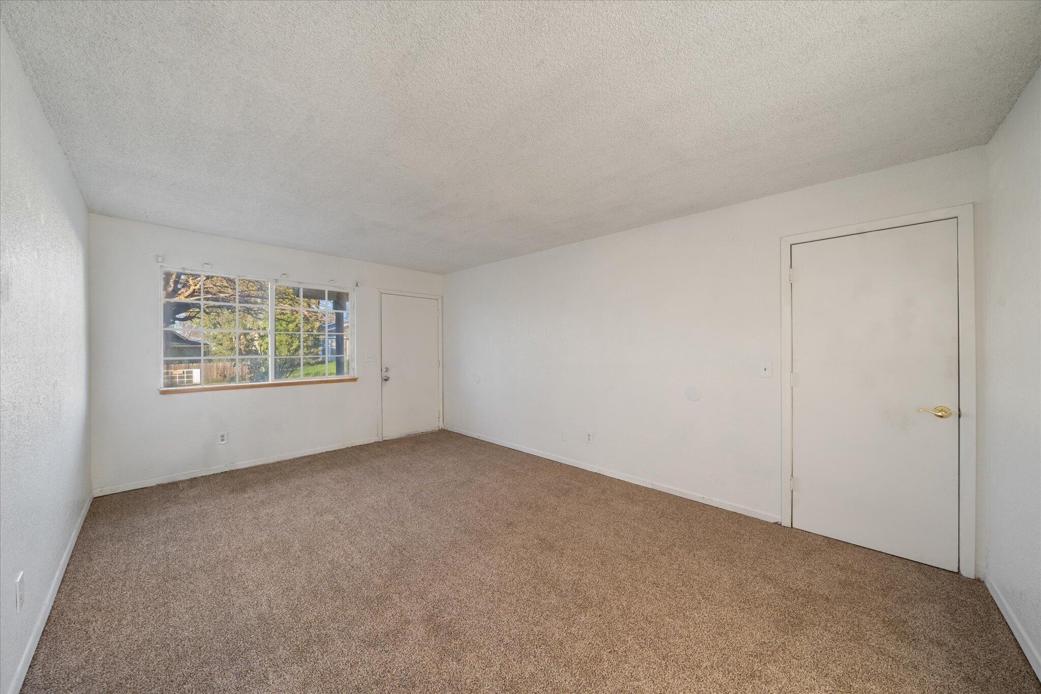 1994 Spruce Circle Anderson, CA 96007 - Photo 4 of 16 an empty room with windows