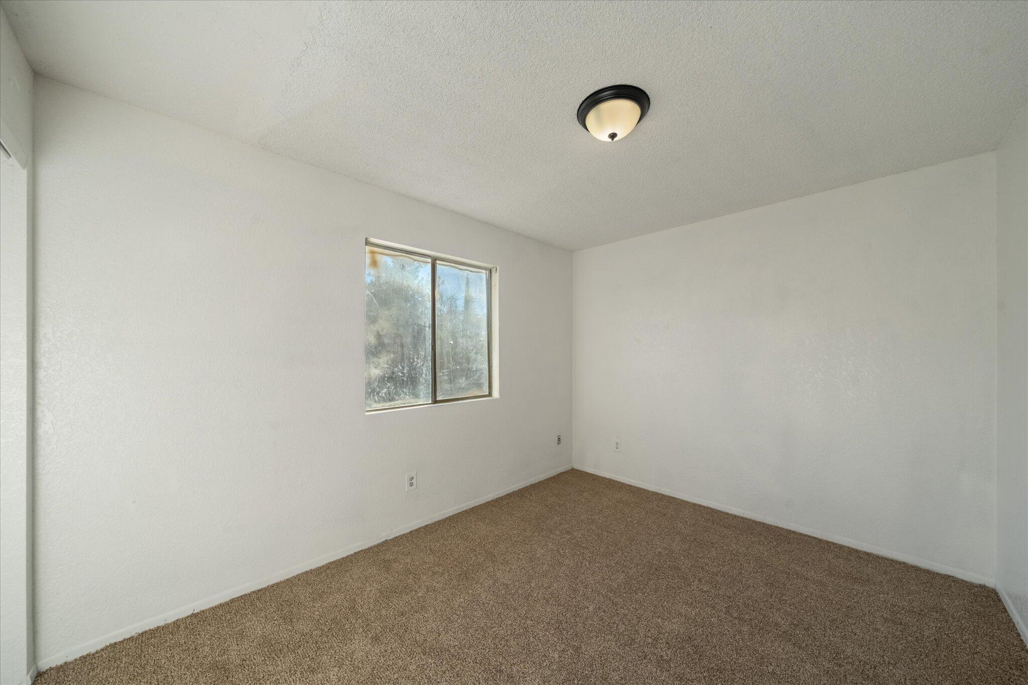 1994 Spruce Circle Anderson, CA 96007 - Photo 8 of 16 an empty room with windows