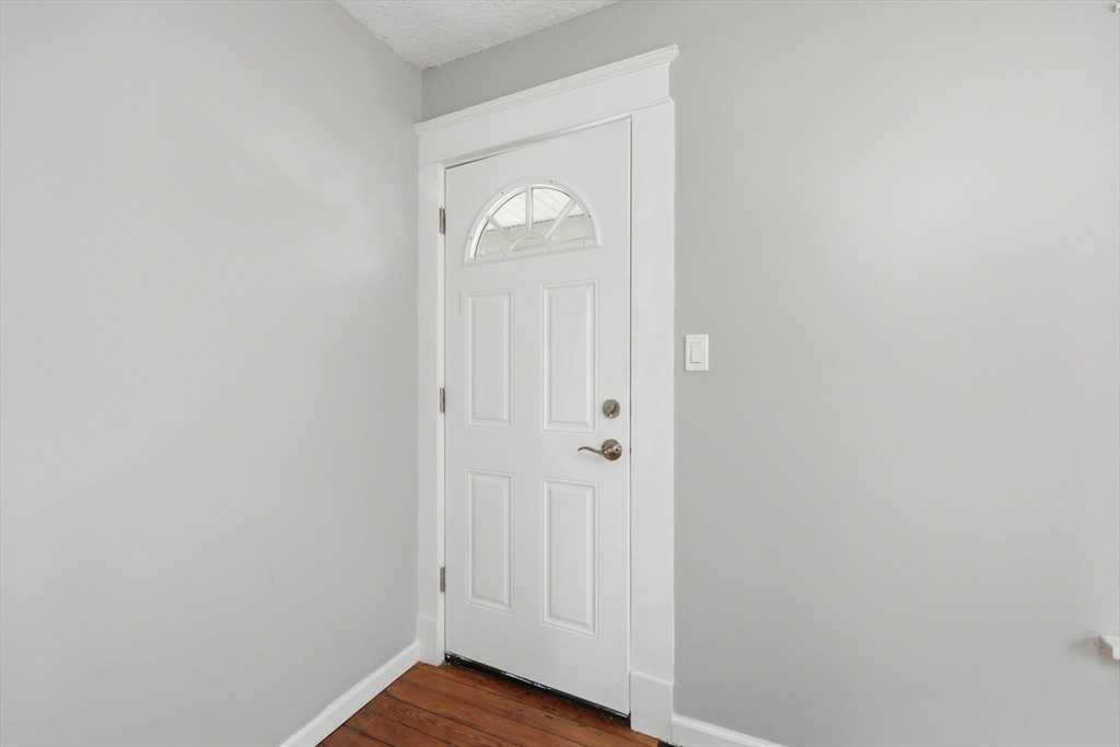 62 Kenyon Street Springfield, MA 01109 - Photo 4 of 26 a view of a hallway with wooden floor