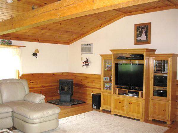 42 J Davis Road Charlton, MA 01507 - Photo 8 of 30 a living room with furniture and a flat screen tv