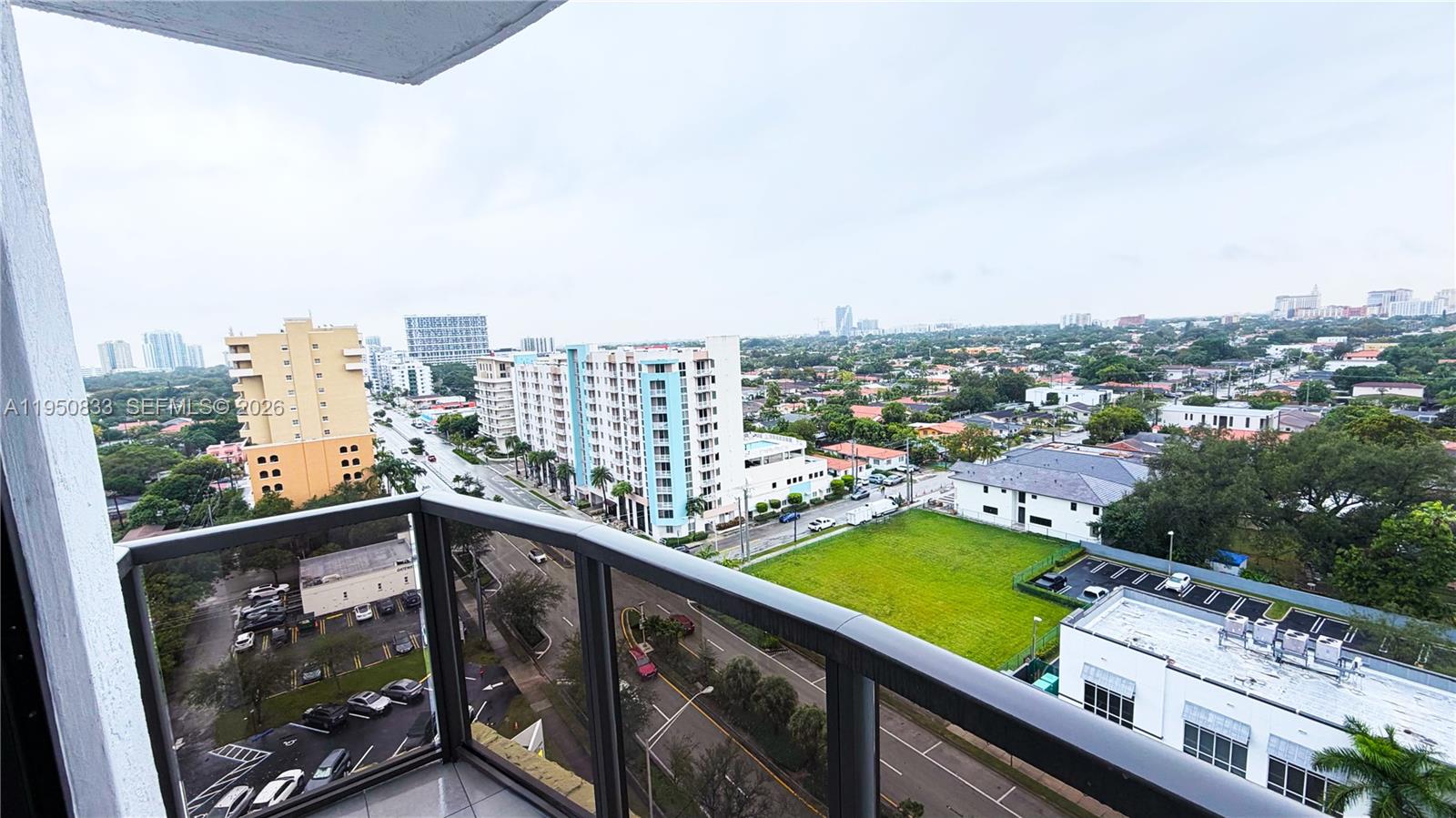 2301 Southwest 27th Avenue, Unit 1200 Miami, FL 33145 - Photo 19 of 24 a view of swimming pool from a balcony