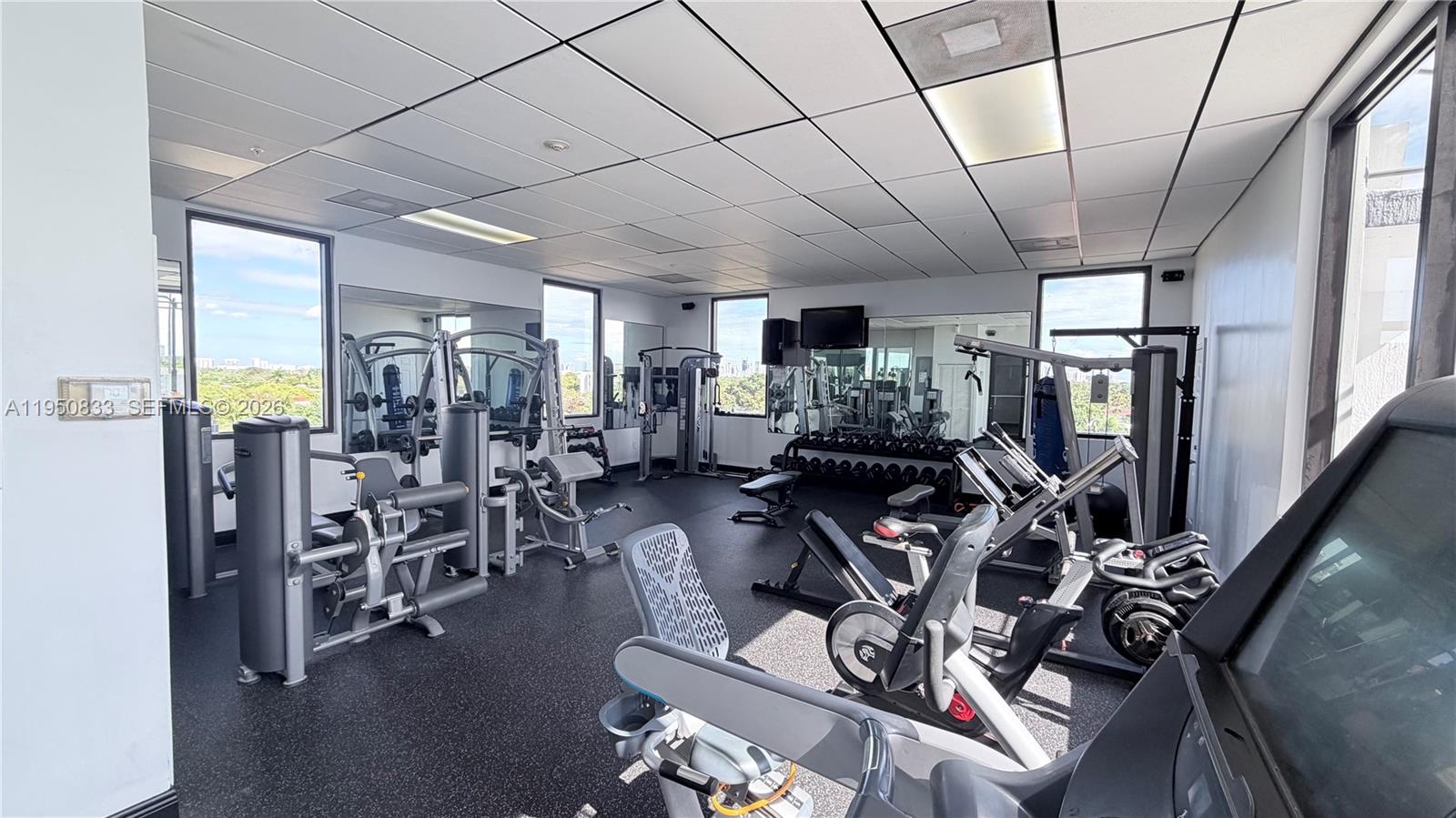 2301 Southwest 27th Avenue, Unit 1200 Miami, FL 33145 - Photo 23 of 24 a view of a livingroom with furniture and a window