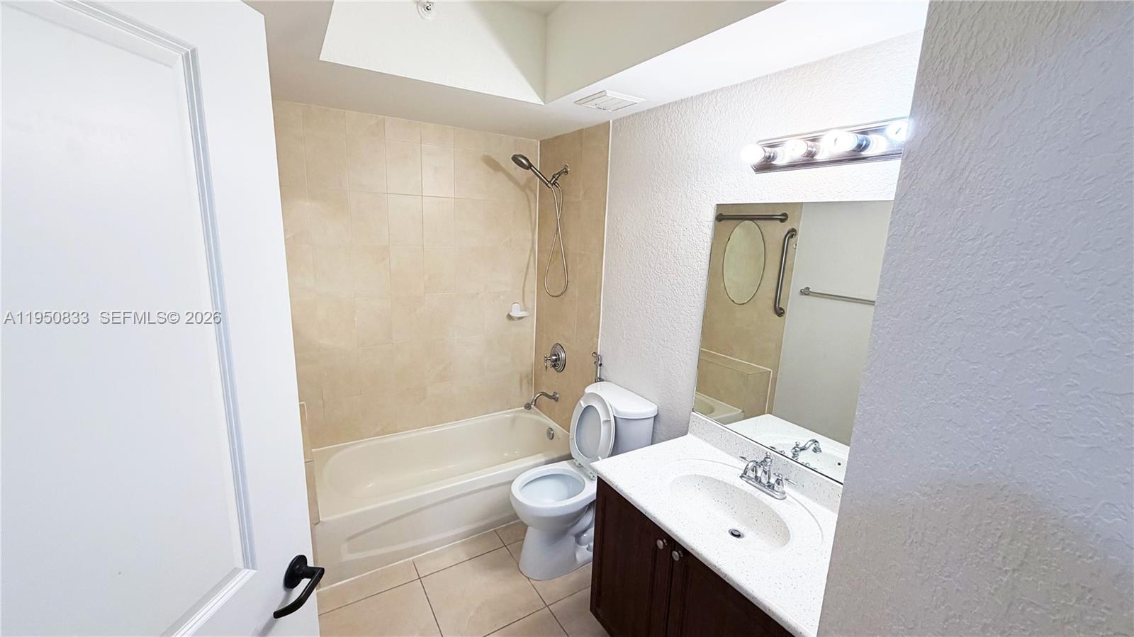 2301 Southwest 27th Avenue, Unit 1200 Miami, FL 33145 - Photo 6 of 24 a bathroom with a sink a toilet and shower