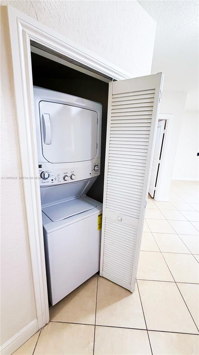 2301 Southwest 27th Avenue, Unit 1200 Miami, FL 33145 - Photo 7 of 24 a utility room with washer and dryer