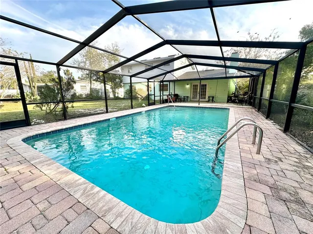 a view of a swimming pool with a patio