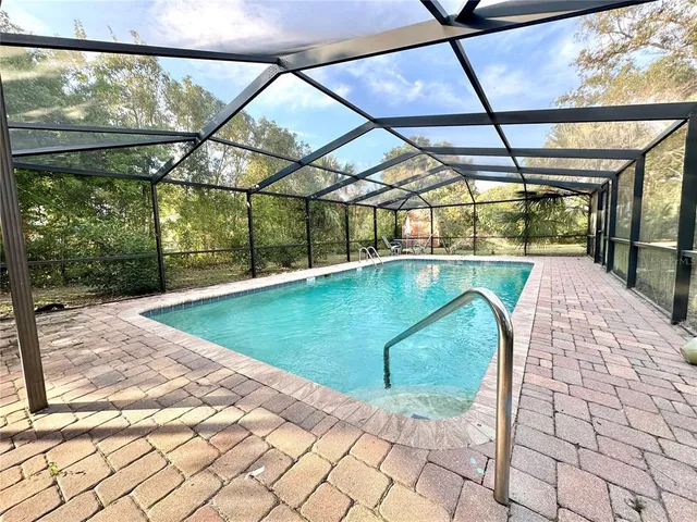 a view of a swimming pool with an outdoor space