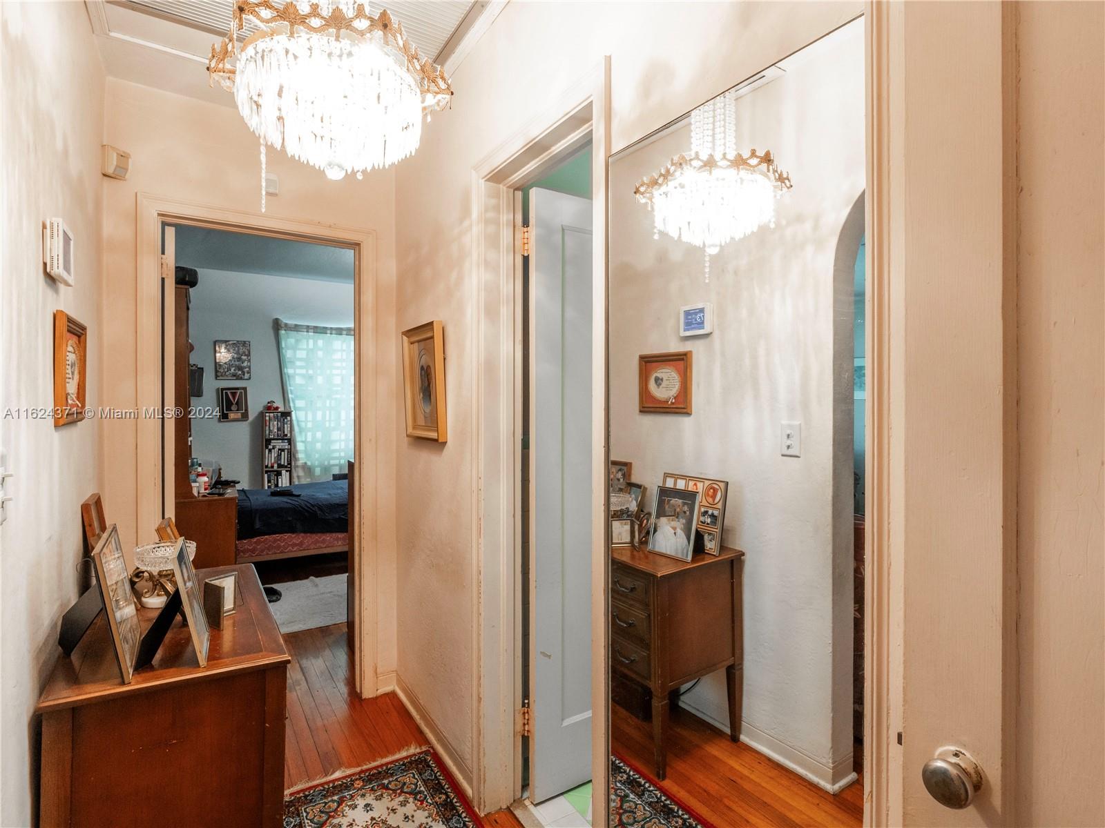 820 Southwest 26th Road Miami, FL 33129 - Photo 13 of 20 a view of a hallway with a livingroom and dining room