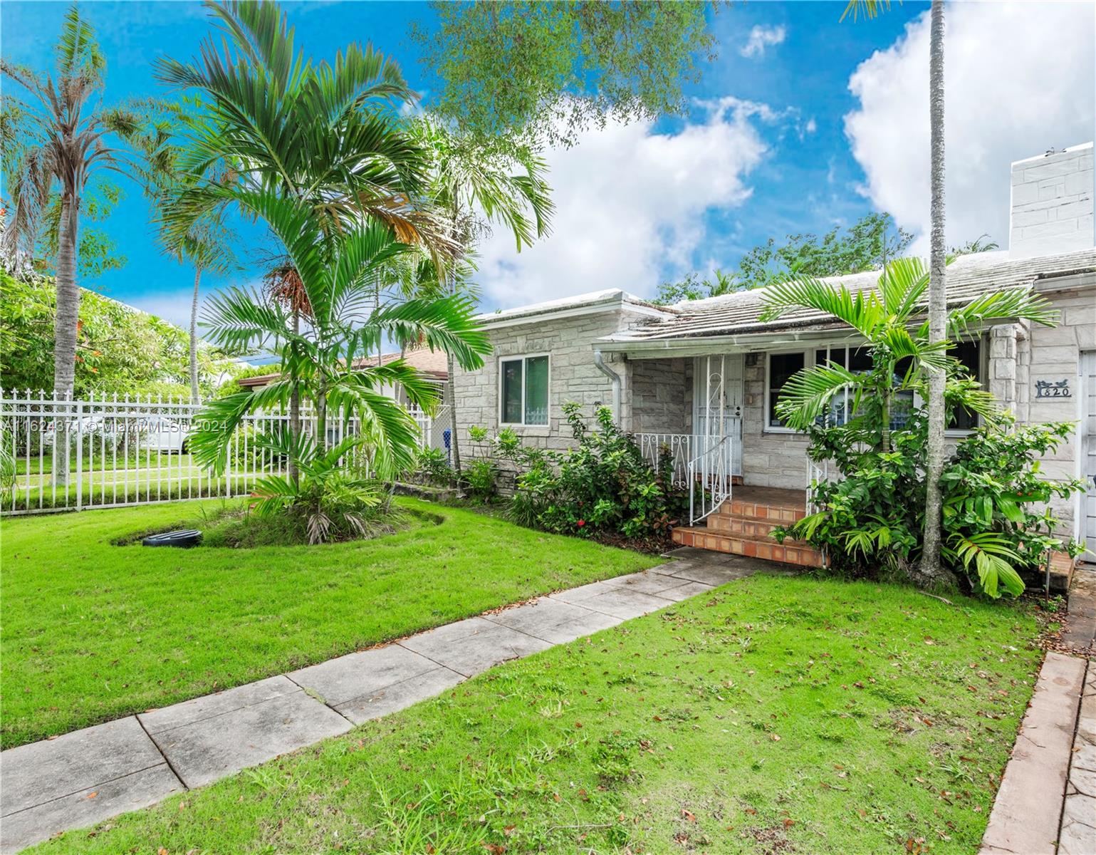 820 Southwest 26th Road Miami, FL 33129 - Photo 3 of 20 a view of a house with a yard and plants