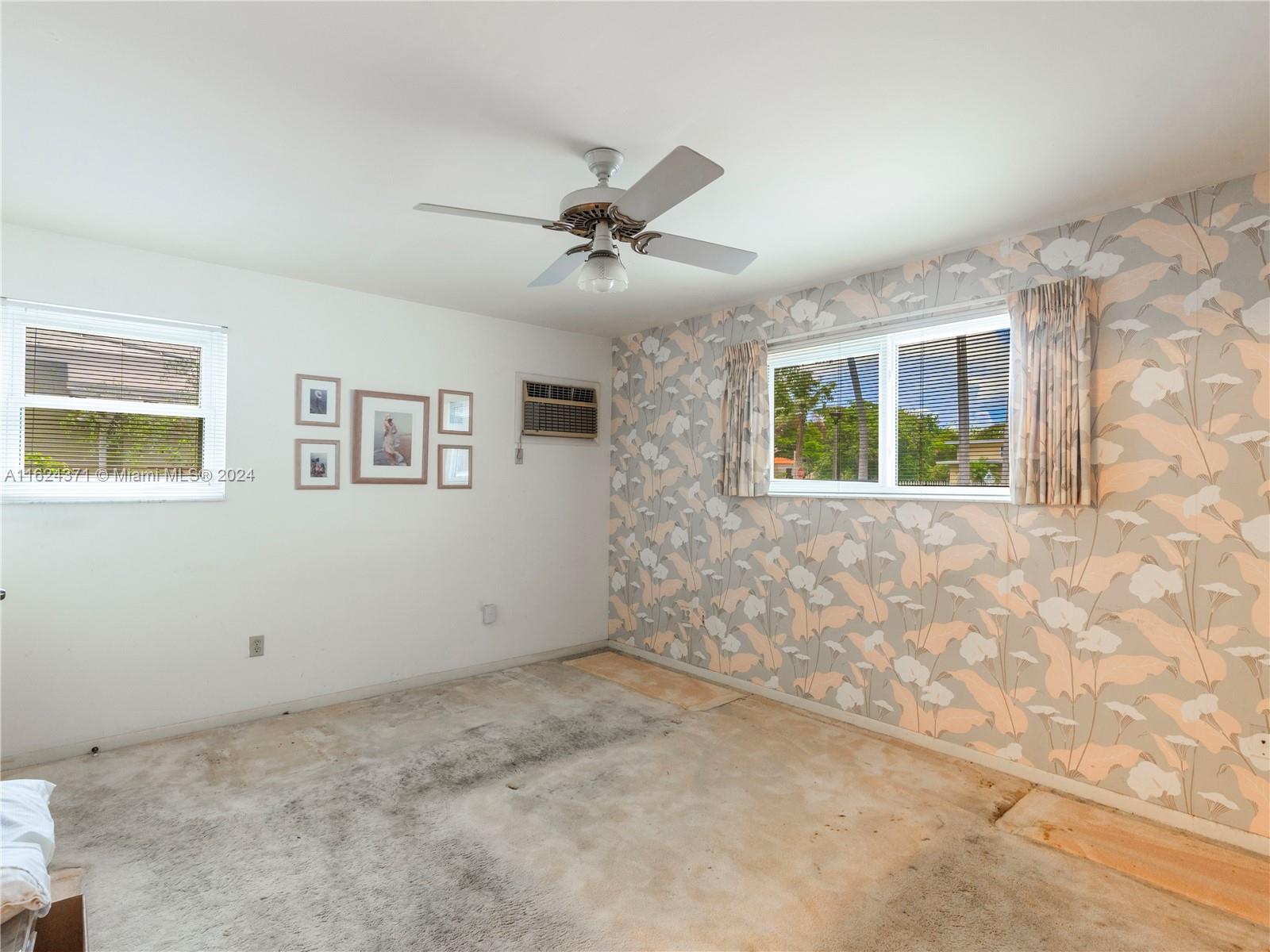 820 Southwest 26th Road Miami, FL 33129 - Photo 9 of 20 a view of an empty room with a window