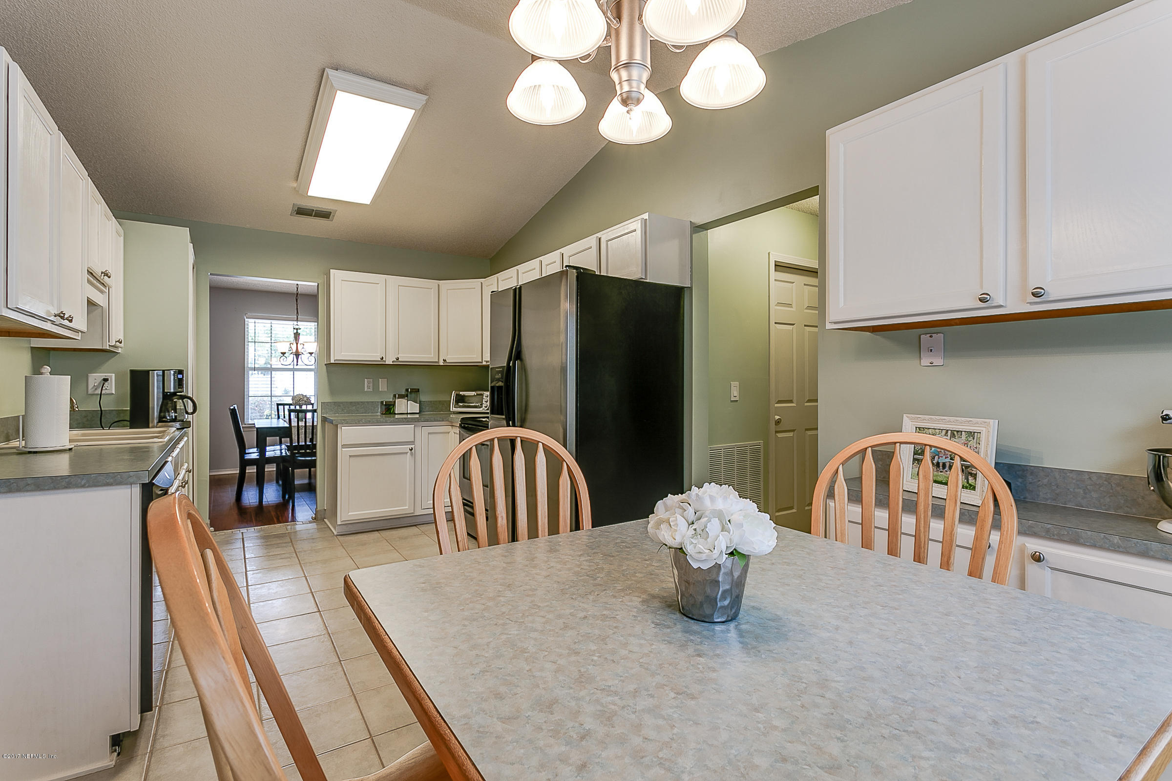 1270 Cutlass Road Orange Park, FL 32065 - Photo 11 of 28 a kitchen with stainless steel appliances granite countertop a refrigerator a sink a stove and cabinets