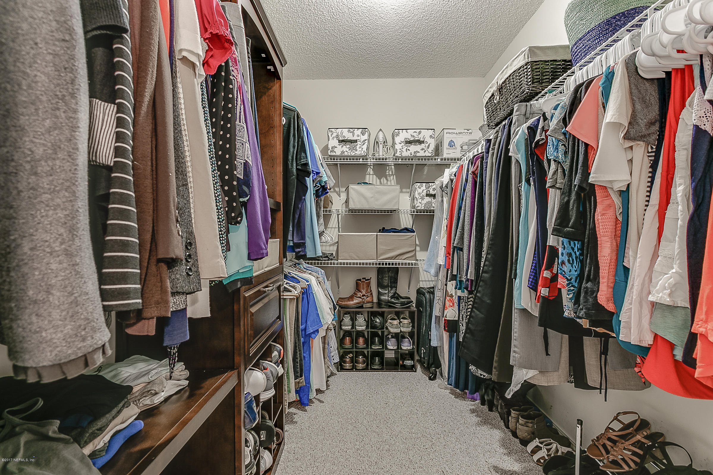 1270 Cutlass Road Orange Park, FL 32065 - Photo 17 of 28 a view of walk in closet with clothes