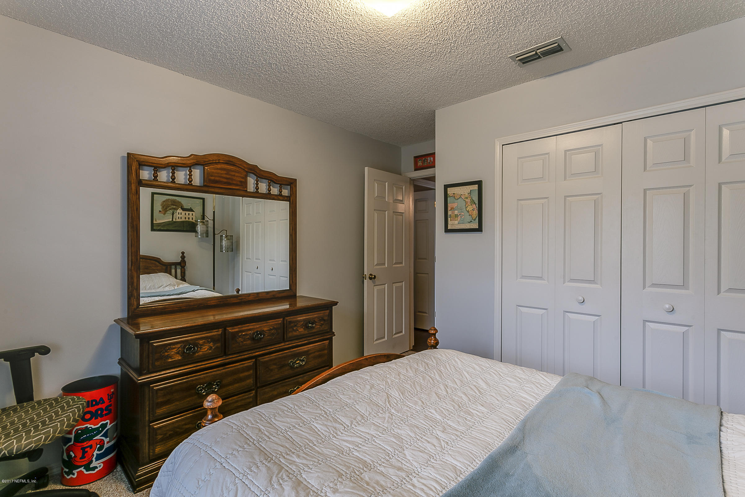 1270 Cutlass Road Orange Park, FL 32065 - Photo 20 of 28 a bedroom with a bed and a dresser