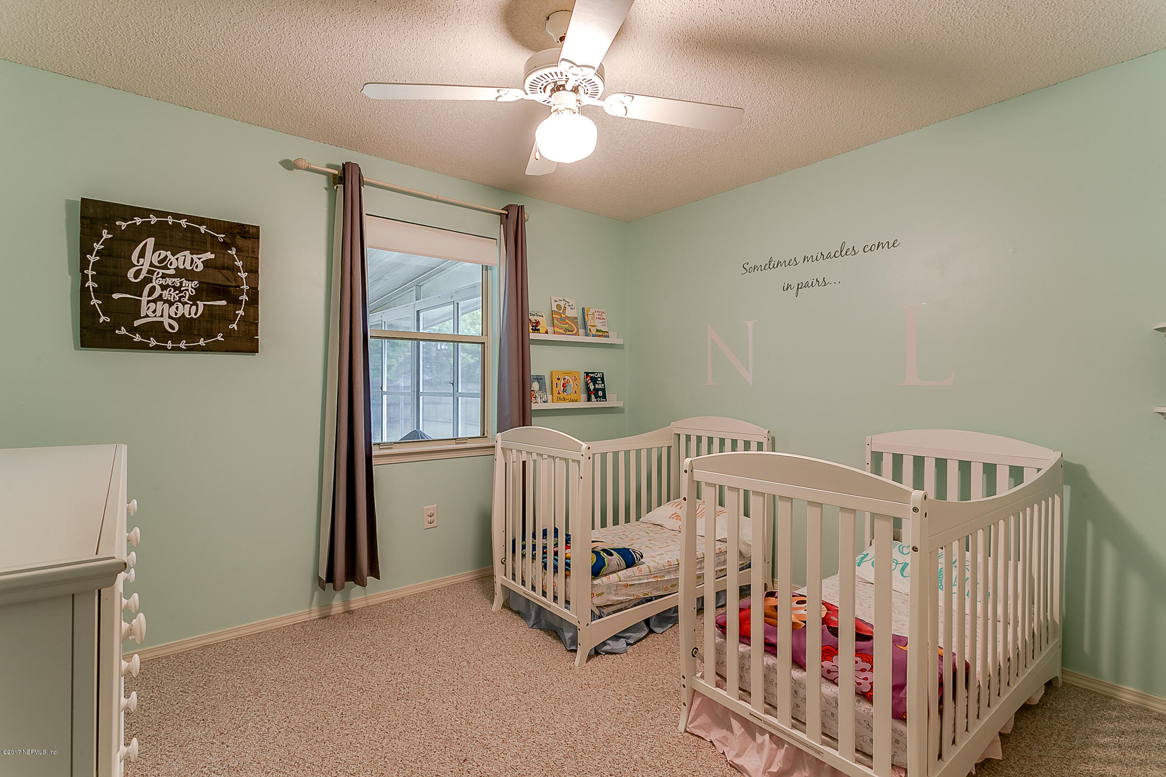 1270 Cutlass Road Orange Park, FL 32065 - Photo 21 of 28 a bedroom with furniture and a window