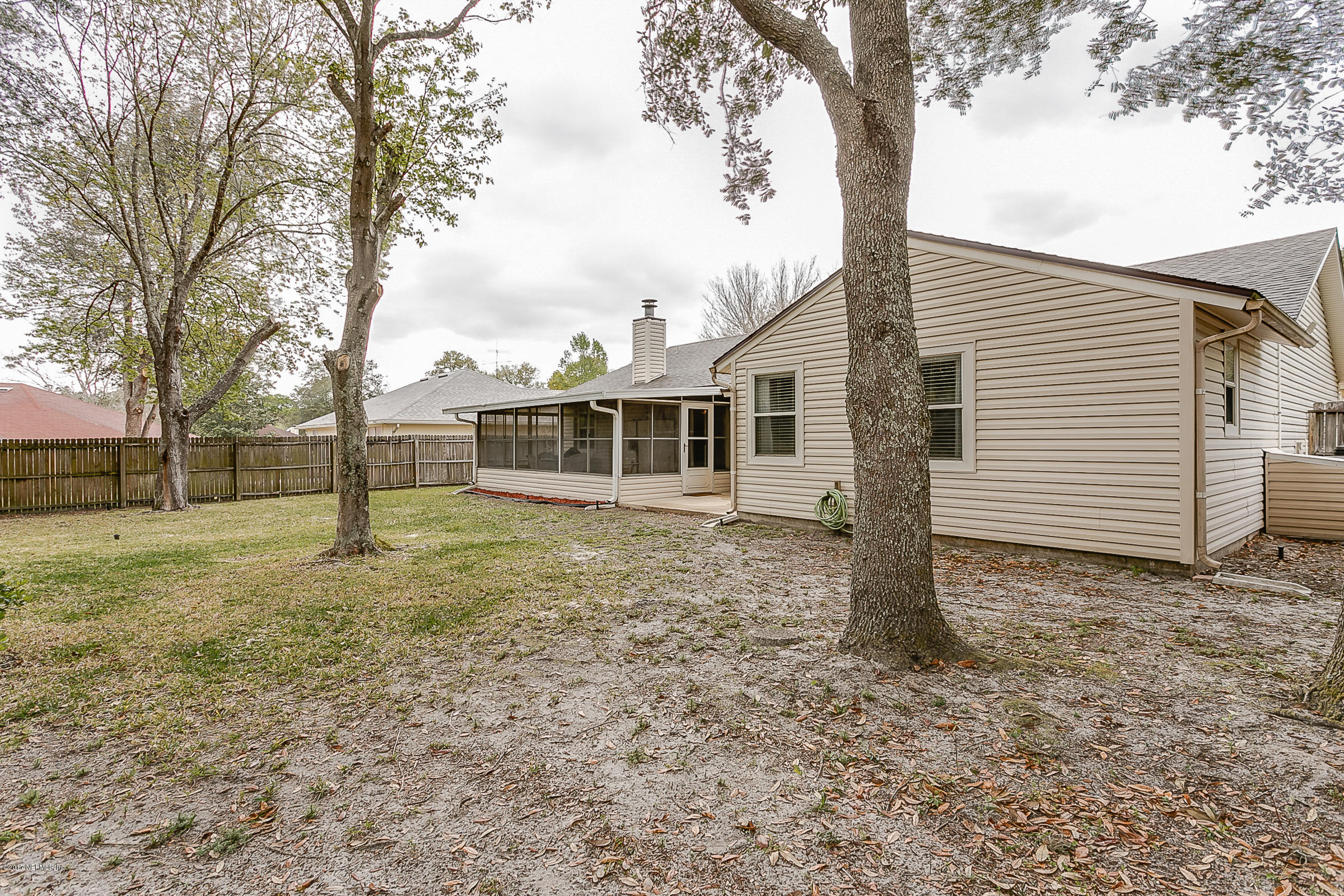 1270 Cutlass Road Orange Park, FL 32065 - Photo 26 of 28 a view of a house with a yard
