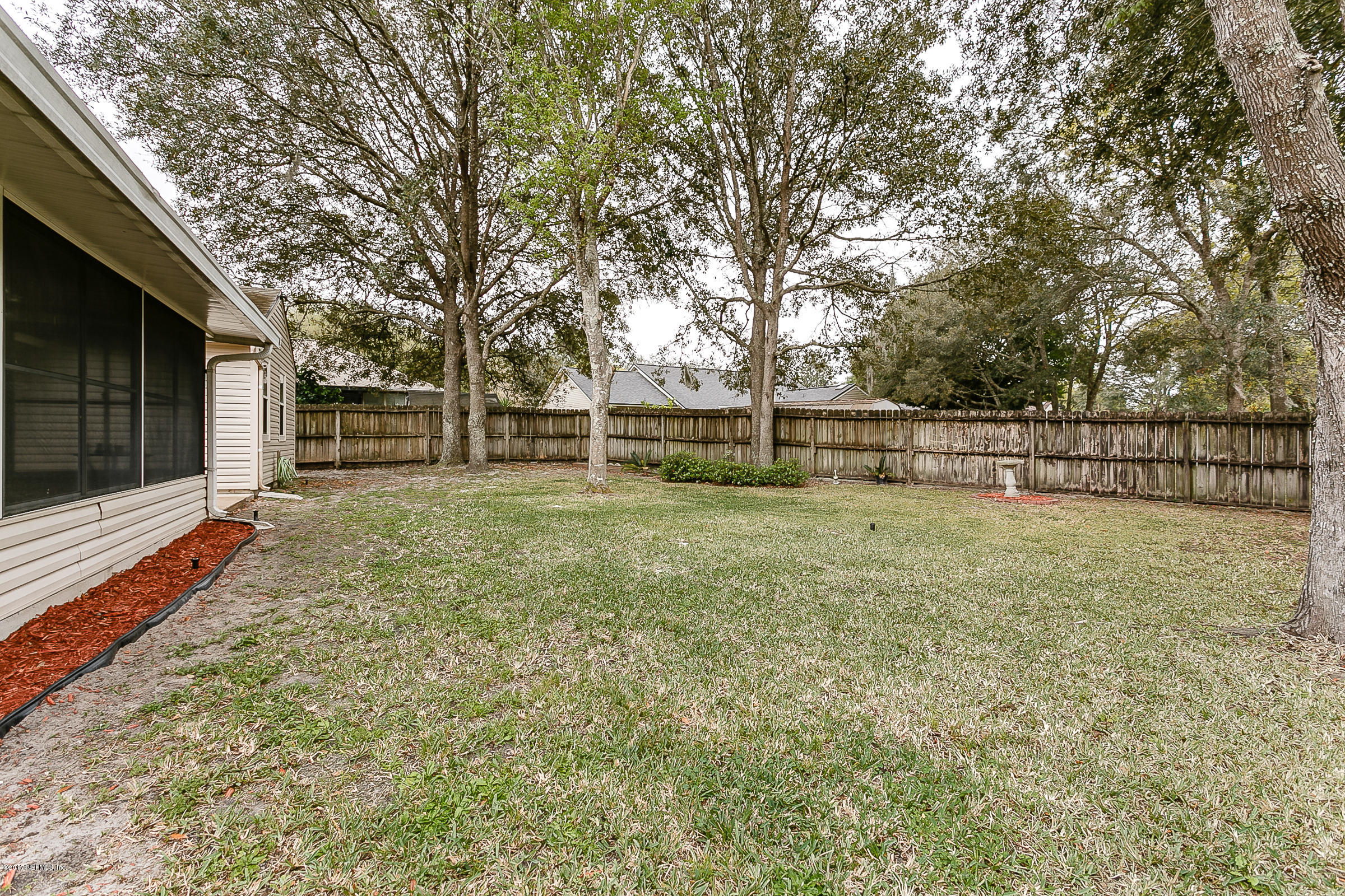 1270 Cutlass Road Orange Park, FL 32065 - Photo 27 of 28 a view of a backyard with large trees