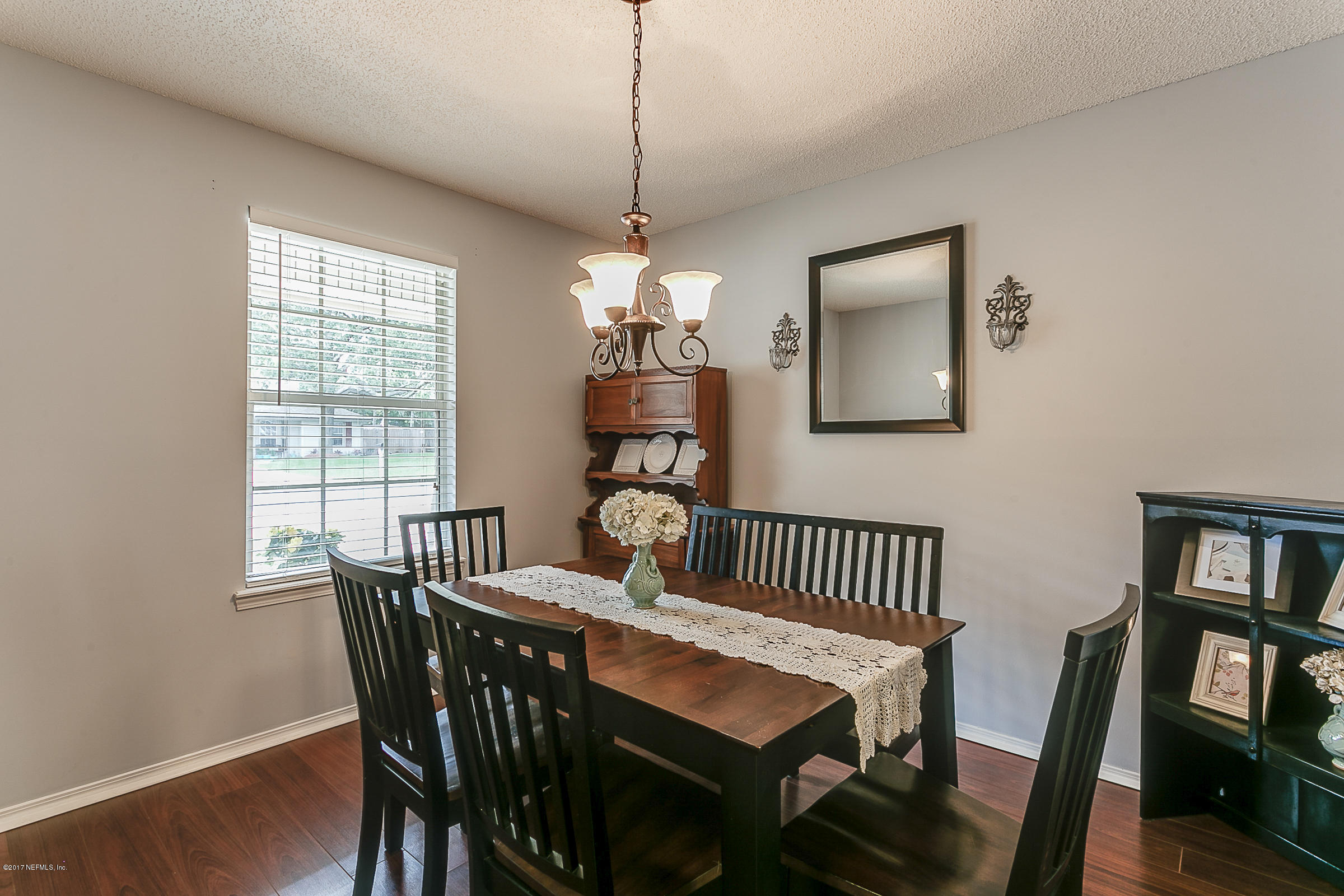 1270 Cutlass Road Orange Park, FL 32065 - Photo 6 of 28 a view of a dining room with furniture window and wooden floor