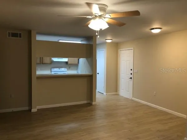 a view of a kitchen with a sink dishwasher and a refrigerator