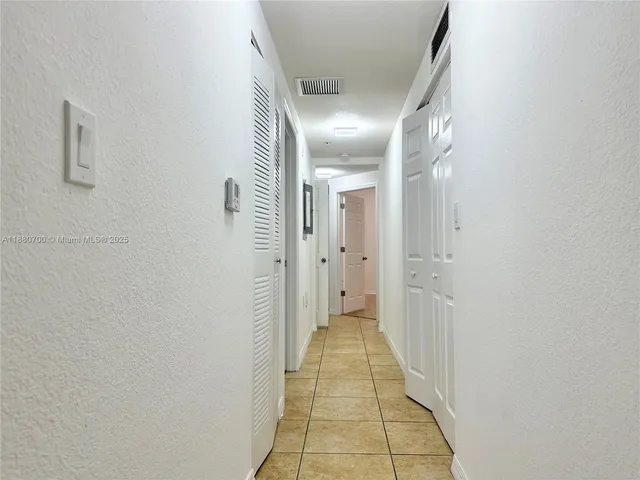 a bathroom with a bathtub a sink a mirror and a shower