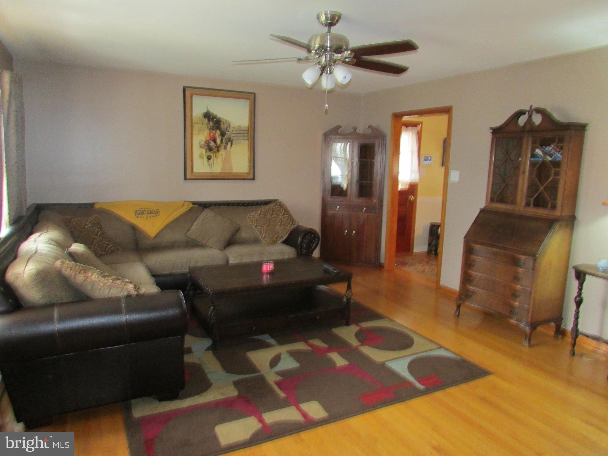 119 Orchard Drive Ranson, WV 25438 - Photo 8 of 28 a living room with furniture and a rug