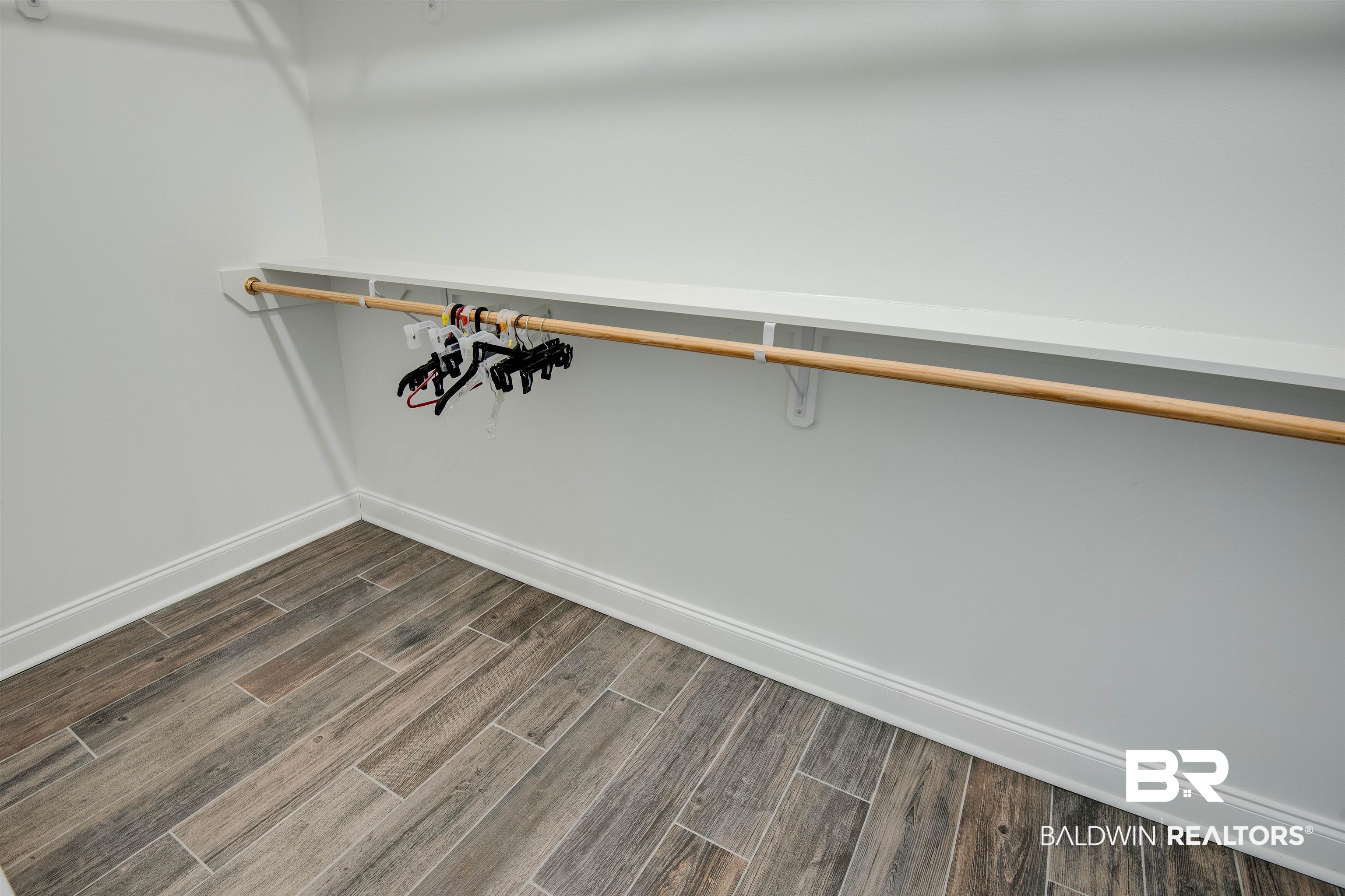 9843 Chipper Lane Foley, AL 36535 - Photo 18 of 34 Spacious closet featuring dark wood-style flooring
