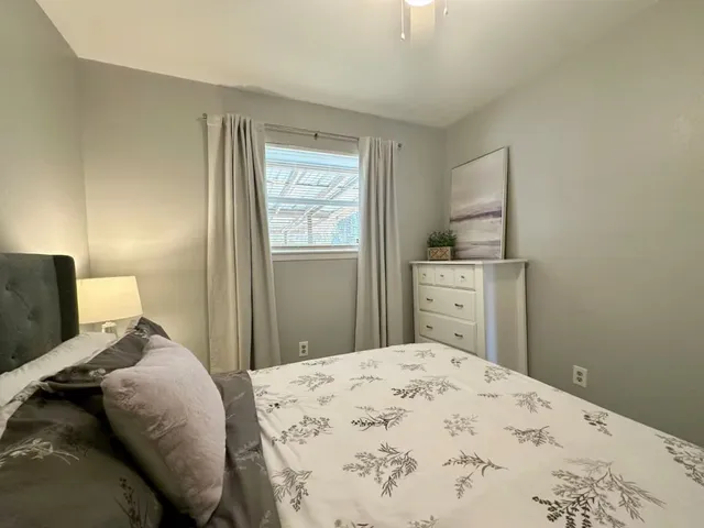 a bedroom with a bed and a cabinets