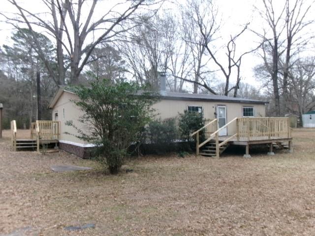 9603 Rosalie Loop Keithville, LA 71047 - Photo 3 of 14 a backyard of a house with table and chairs