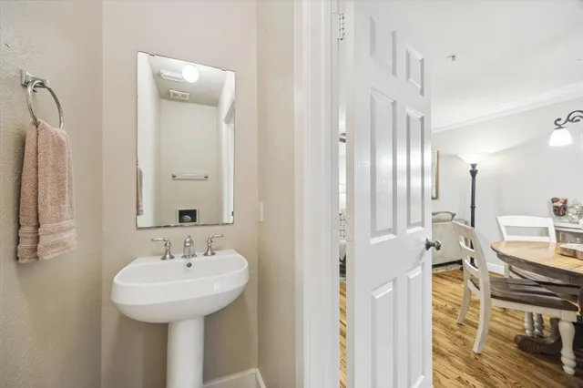 a bathroom with a sink a mirror and a shower