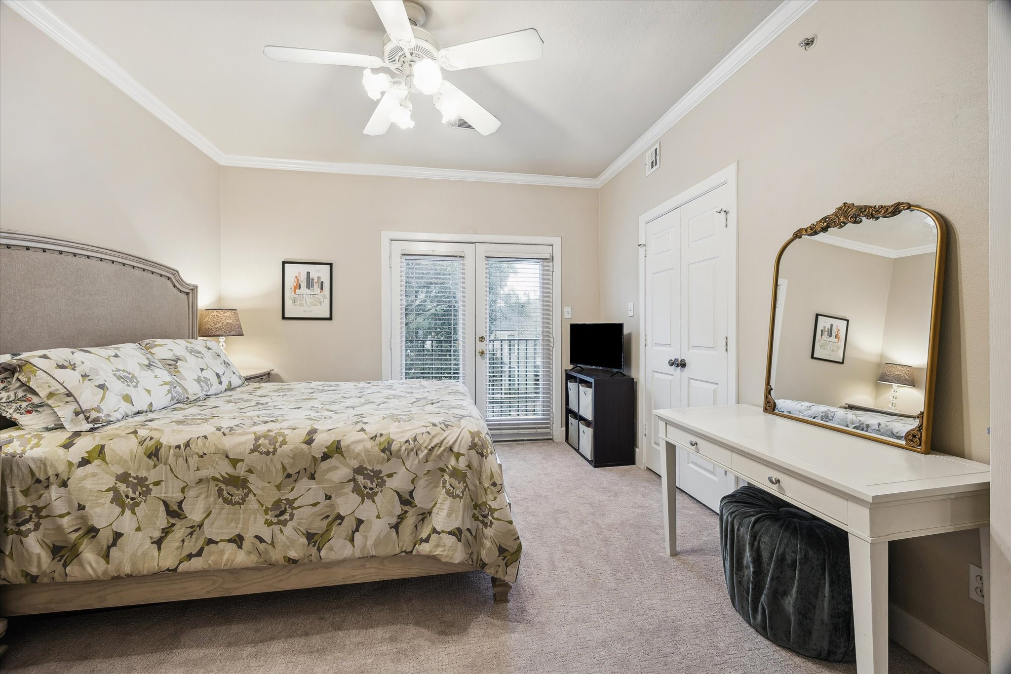 1342 Rutland Street, Unit 203 Houston, TX 77008 - Photo 13 of 20 a bedroom with a bed dresser and a flat tv screen