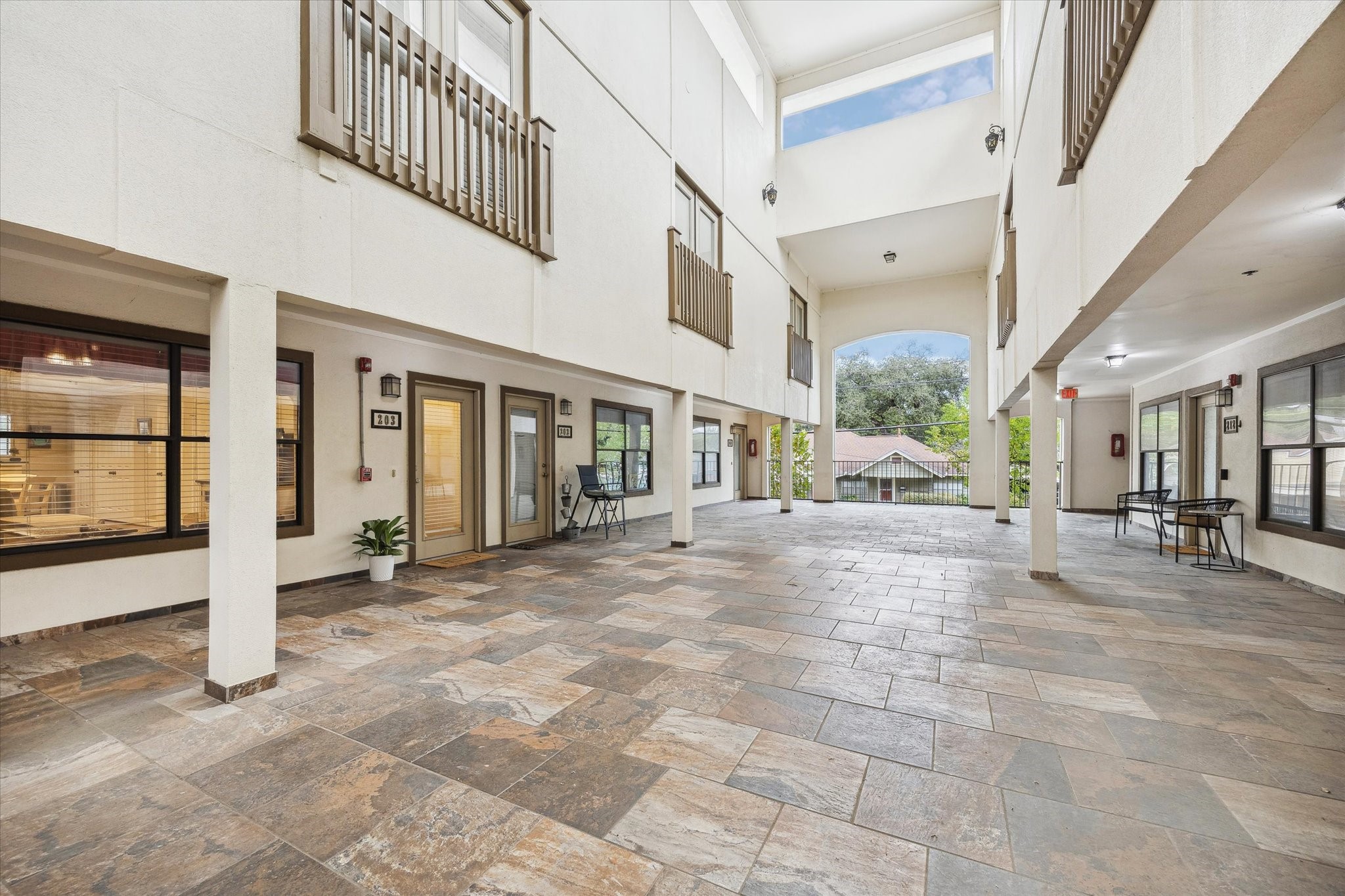 1342 Rutland Street, Unit 203 Houston, TX 77008 - Photo 2 of 20 a view of a building with a patio