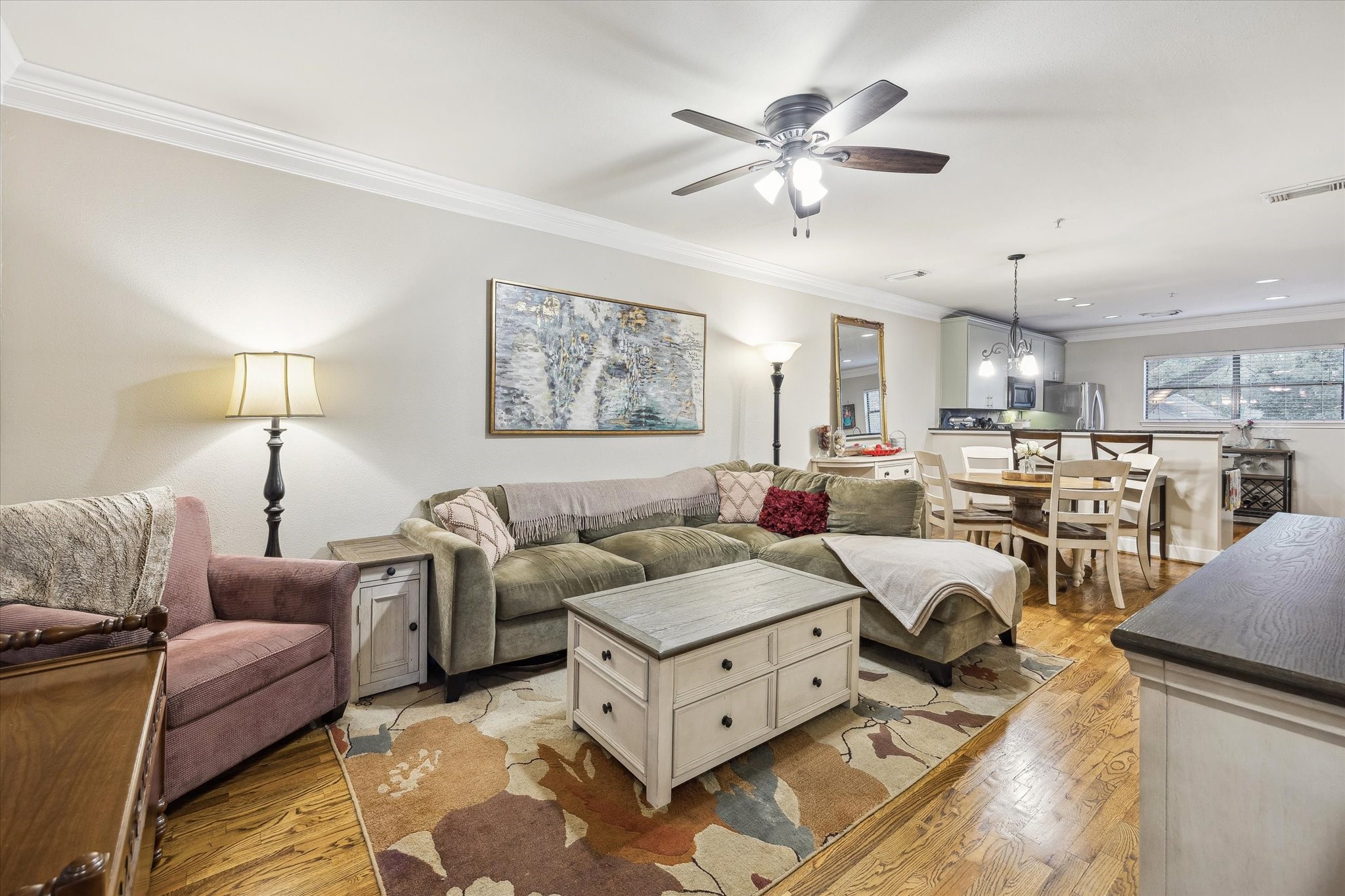 1342 Rutland Street, Unit 203 Houston, TX 77008 - Photo 5 of 20 a living room with furniture kitchen view and a chandelier