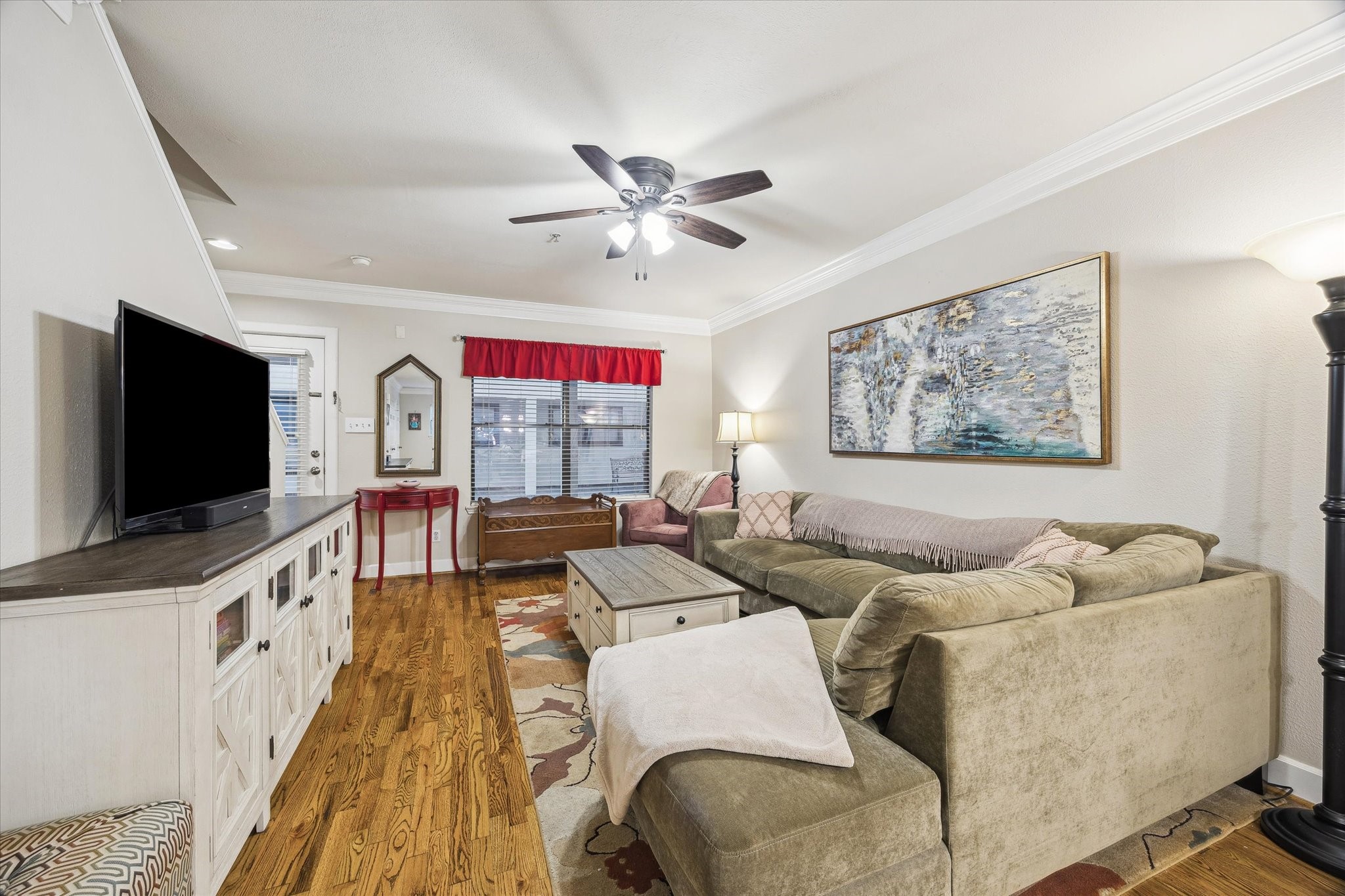 1342 Rutland Street, Unit 203 Houston, TX 77008 - Photo 6 of 20 a living room with furniture and a flat screen tv