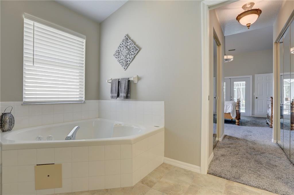 562 Rolling Hill Drive Sebastian, FL 32958 - Photo 22 of 42 a bathroom with a bathtub and a shower