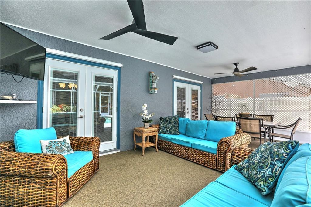 562 Rolling Hill Drive Sebastian, FL 32958 - Photo 28 of 42 a living room with furniture and a large window