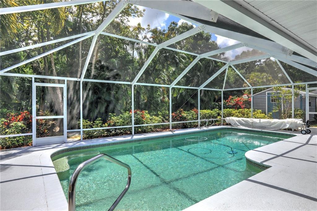 562 Rolling Hill Drive Sebastian, FL 32958 - Photo 29 of 42 a view of a house with a big yard and potted plants