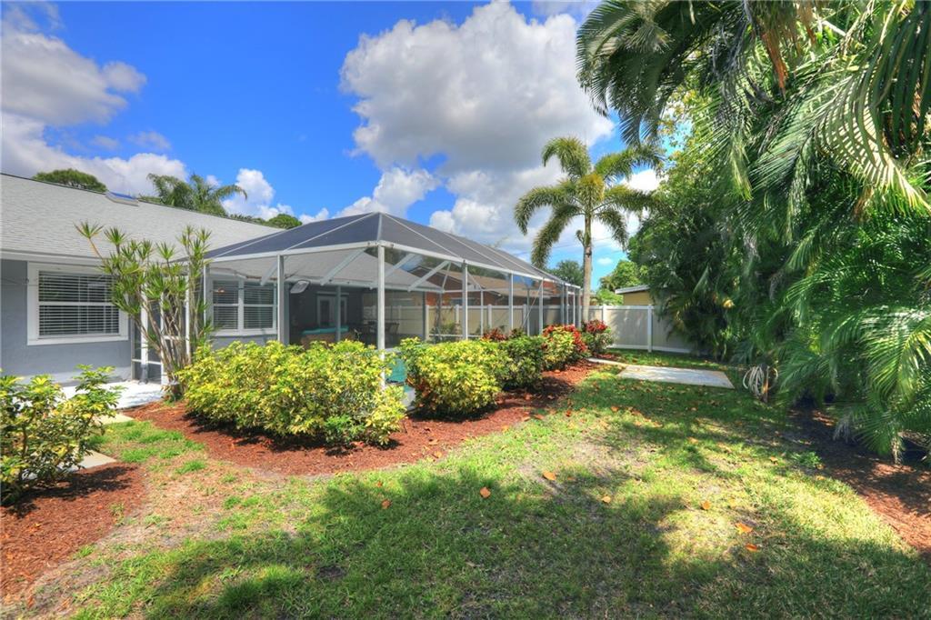 562 Rolling Hill Drive Sebastian, FL 32958 - Photo 32 of 42 a front view of a house with garden