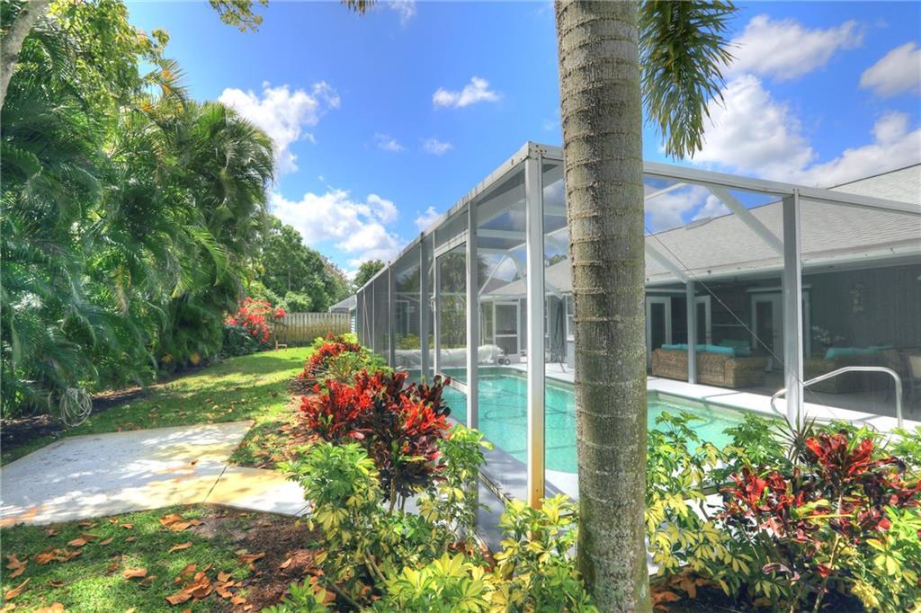 562 Rolling Hill Drive Sebastian, FL 32958 - Photo 34 of 42 a small yard with fountain in the back yard