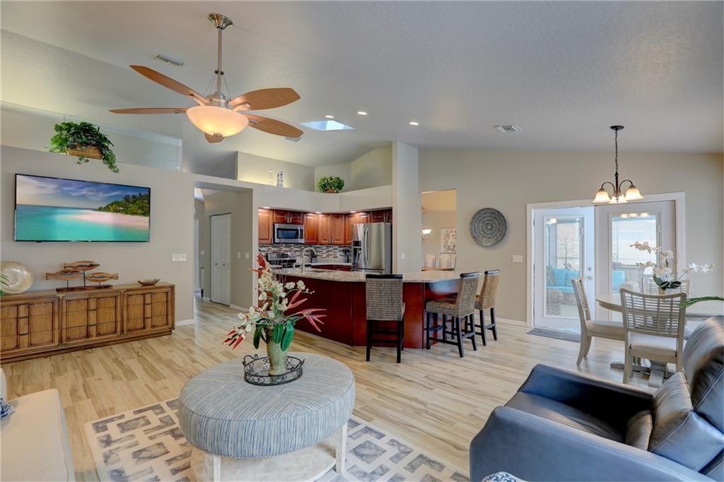 562 Rolling Hill Drive Sebastian, FL 32958 - Photo 10 of 42 a living room with furniture and a flat screen tv