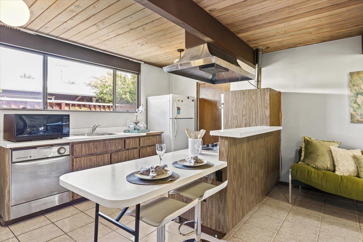 1103 East Homestead Road Sunnyvale, CA 94087 - Photo 12 of 29 a open kitchen with a table and chairs