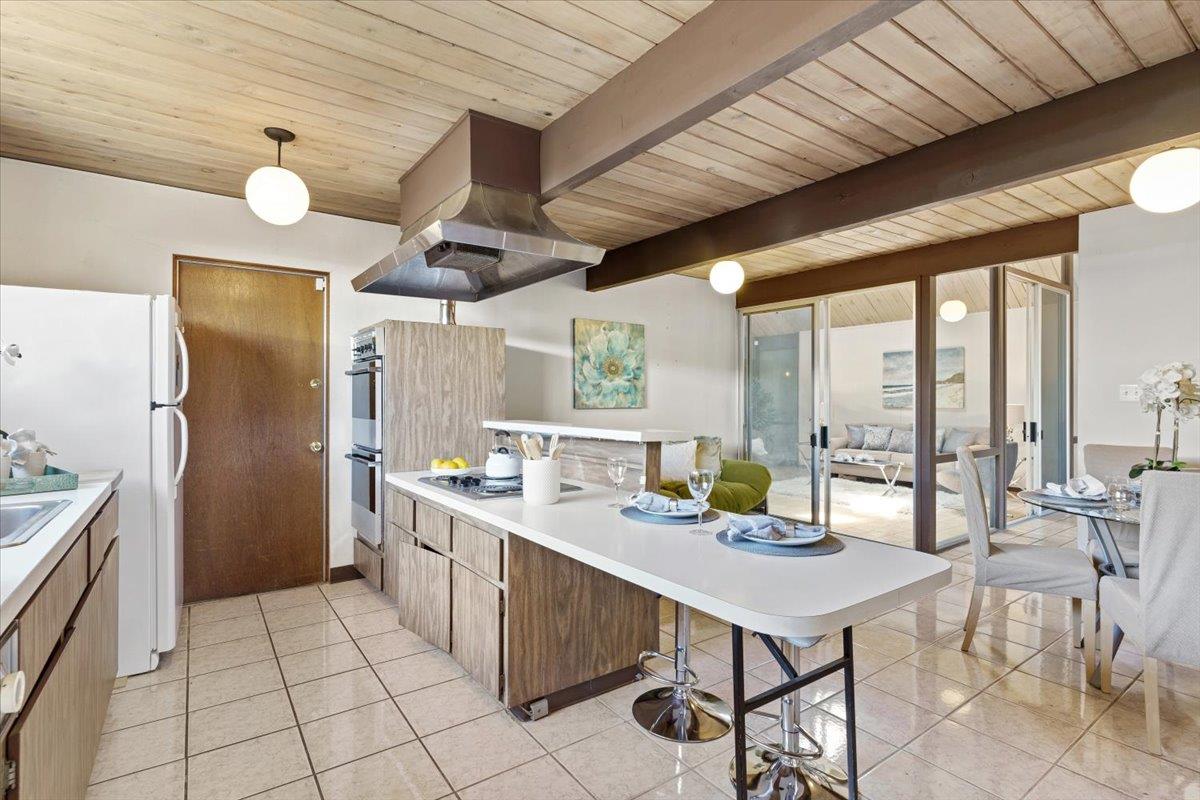 1103 East Homestead Road Sunnyvale, CA 94087 - Photo 13 of 29 a kitchen with a sink a counter top space and stainless steel appliances
