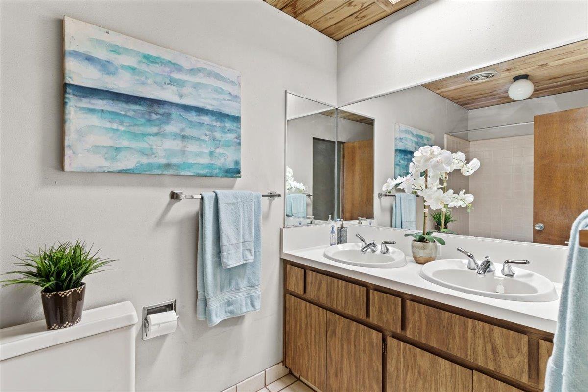 1103 East Homestead Road Sunnyvale, CA 94087 - Photo 16 of 29 a bathroom with a sink a mirror and a potted plant