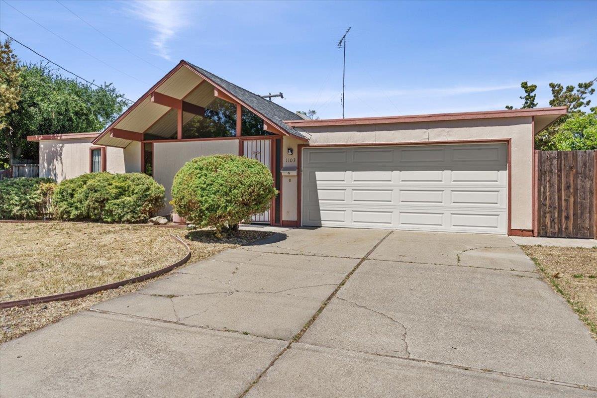 1103 East Homestead Road Sunnyvale, CA 94087 - Photo 26 of 29 a front view of a house with a yard and garage