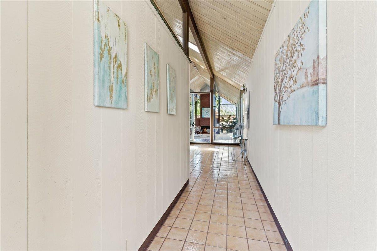 1103 East Homestead Road Sunnyvale, CA 94087 - Photo 6 of 29 a hallway with wooden floor in a house