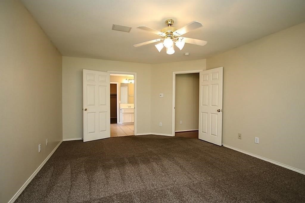 28511 Cory Terrace Court Spring, TX 77386 - Photo 18 of 31 a view of an empty room with a chandelier fan