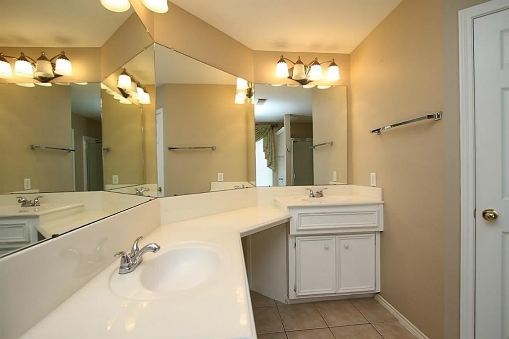 28511 Cory Terrace Court Spring, TX 77386 - Photo 19 of 31 a bathroom with a sink vanity and a mirror