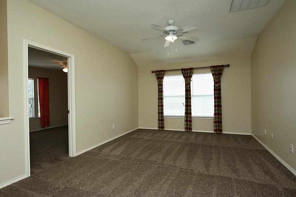28511 Cory Terrace Court Spring, TX 77386 - Photo 23 of 31 a view of an empty room with chandelier fan and window