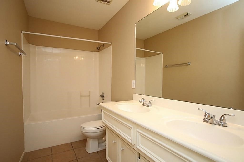 28511 Cory Terrace Court Spring, TX 77386 - Photo 26 of 31 a bathroom with a sink a toilet and shower